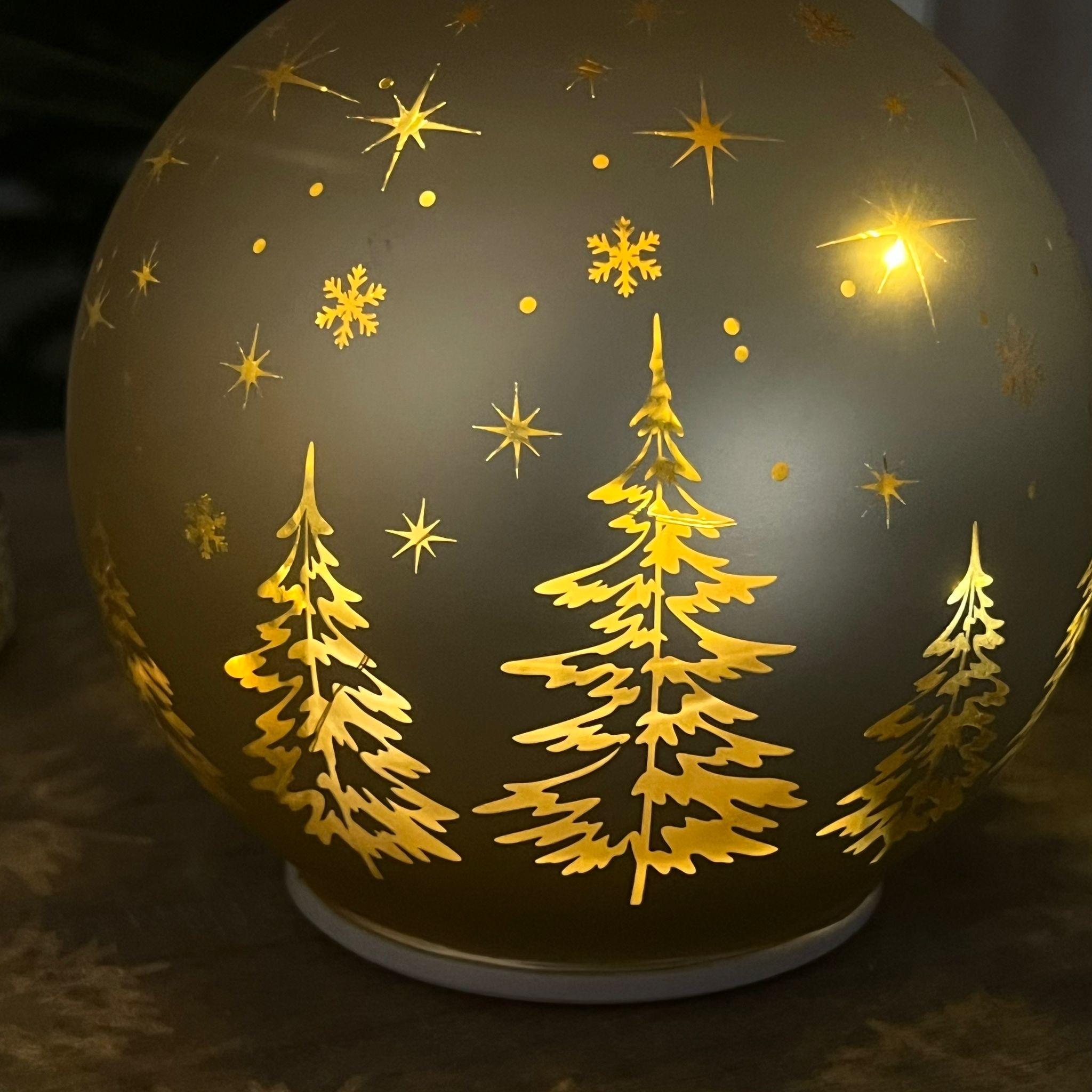 Palla in vetro girevole luminosa oro alberelli