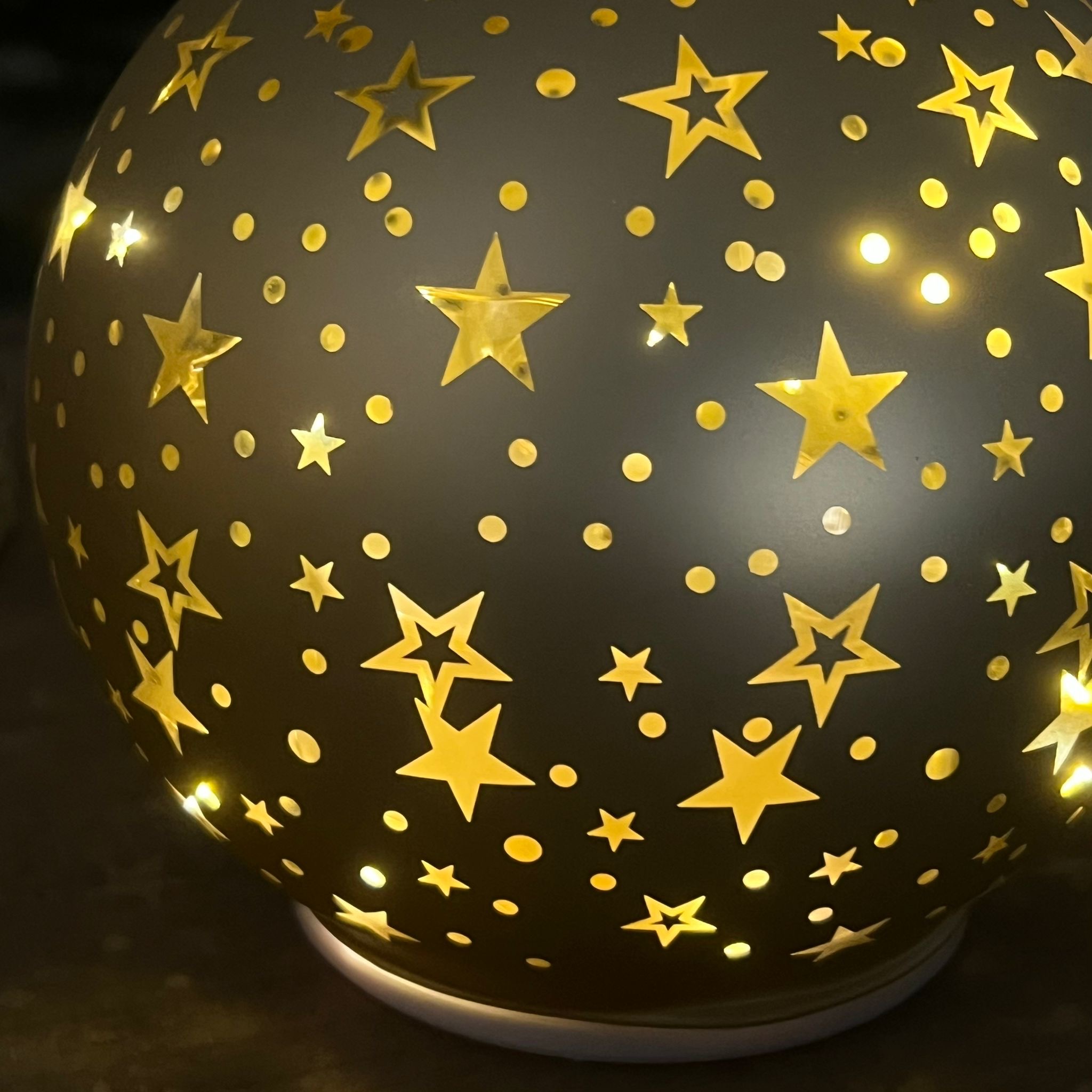 Palla in vetro girevole luminosa oro stelline